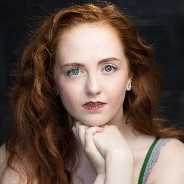 A headshot of Madeline
