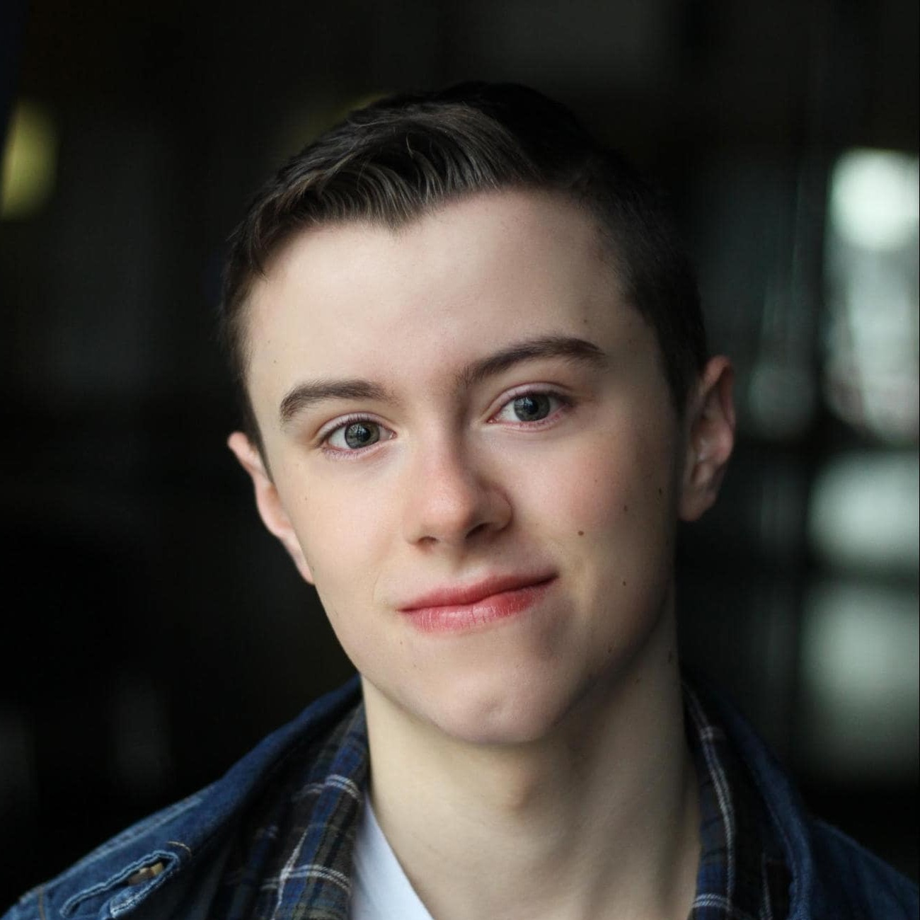 A headshot of Ryan