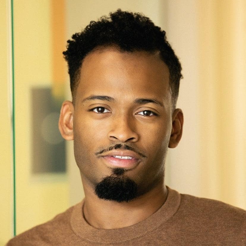A headshot of Verzell